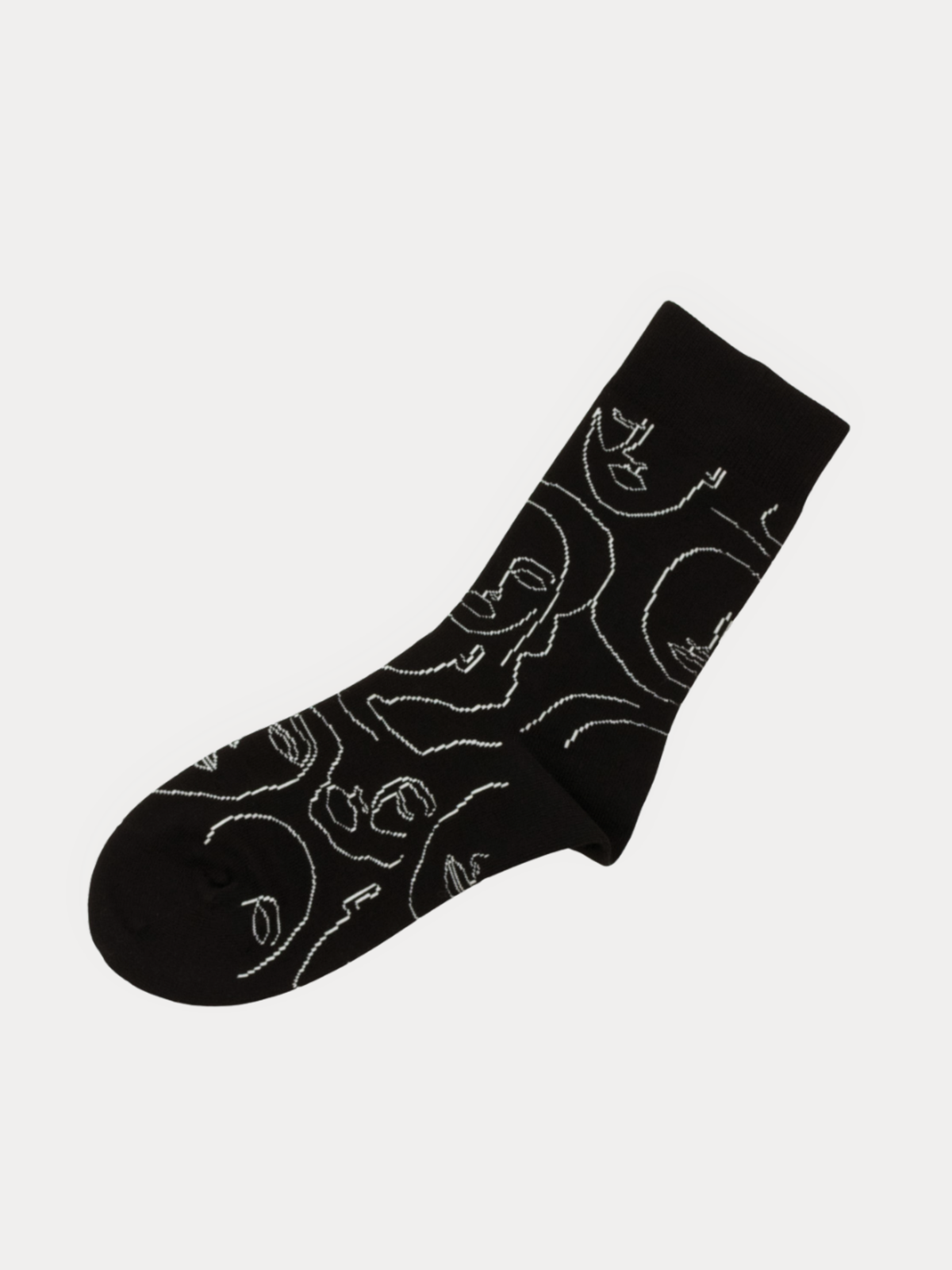 A single black crew sock with a white continuous line art pattern of stylized faces, shown against a light gray background.
