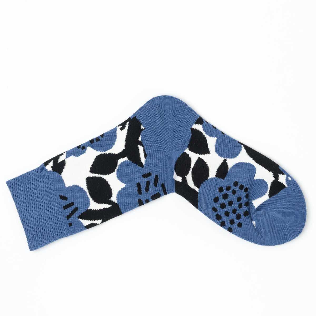 Single blue crew sock folded into a V shape, showing the bold black and white floral print.